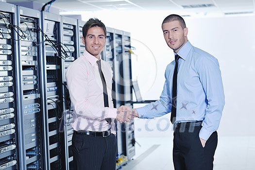 group of young business people it engineer in network server room solving problems and give help and support group of young business people it engineer in network server room solving problems and give help and support