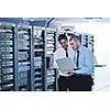 group of young business people it engineer in network server room solving problems and give help and support