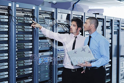 group of young business people it engineer in network server room solving problems and give help and support group of young business people it engineer in network server room solving problems and give help and support