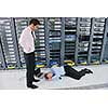 it business man in network server room have problems and looking for  disaster situation  solution