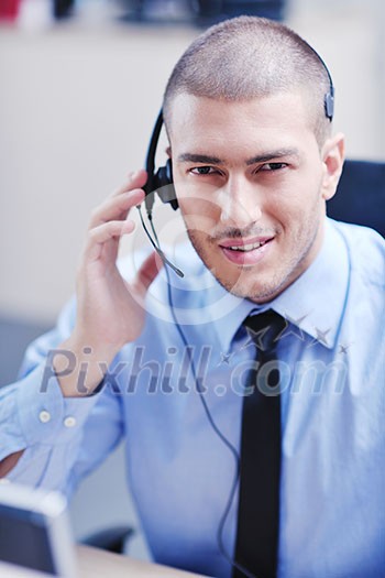 businessman with a headset portrait at bright call center helpdesk support office businessman with a headset portrait at bright call center helpdesk support office