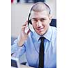 businessman with a headset portrait at bright call center helpdesk support office