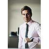 portrait of one young business man at bright office indoor