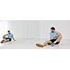 young man in fintess sport club exercise withweights and relaxing