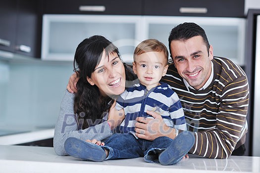 happy young family have fun and relaxing at new home with bright furniture happy young family have fun and relaxing at new home with bright furniture