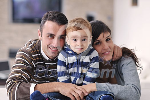 happy young family have fun and relaxing at new home with bright furniture happy young family have fun and relaxing at new home with bright furniture