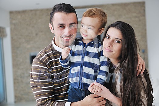 happy young family have fun and relaxing at new home with bright furniture happy young family have fun and relaxing at new home with bright furniture