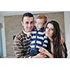 happy young family have fun and relaxing at new home with bright furniture
