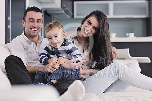 happy young family have fun and relaxing at new home with bright furniture happy young family have fun and relaxing at new home with bright furniture