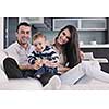 happy young family have fun and relaxing at new home with bright furniture