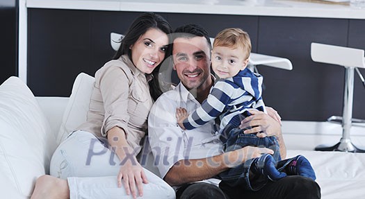 happy young family have fun and relaxing at new home with bright furniture happy young family have fun and relaxing at new home with bright furniture