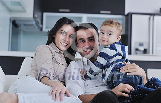 happy young family have fun and relaxing at new home with bright furniture happy young family have fun and relaxing at new home with bright furniture
