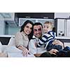 happy young family have fun and relaxing at new home with bright furniture