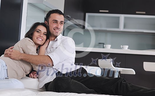 happy young couple relax at modern home living room indoor happy young couple relax at modern home living room indoor