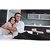 happy young couple relax at modern home living room indoor