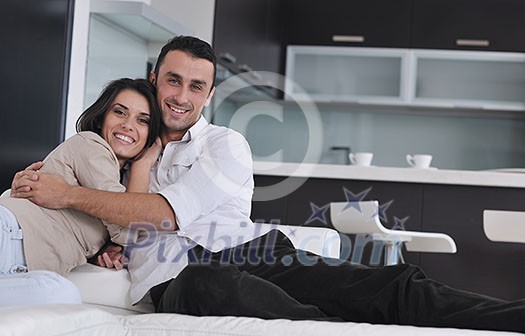 happy young couple relax at modern home living room indoor happy young couple relax at modern home living room indoor