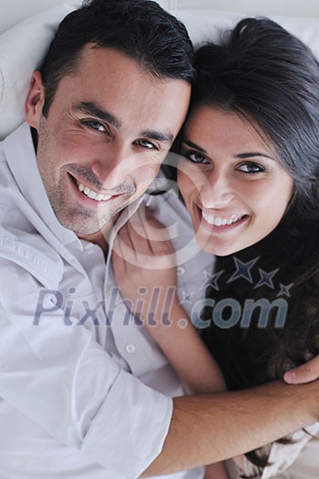 happy young couple relax at modern home living room indoor happy young couple relax at modern home living room indoor