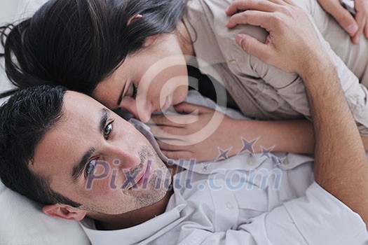 happy young couple relax at modern home living room indoor happy young couple relax at modern home living room indoor