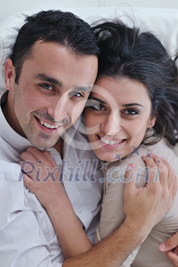 happy young couple relax at modern home living room indoor happy young couple relax at modern home living room indoor