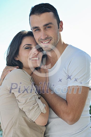 happy young couple in love have romance relax on balcony outdoor with ocean and blue sky in background happy young couple in love have romance relax on balcony outdoor with ocean and blue sky in background