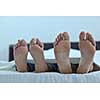 happy young healthy people  couple have good time in their bedroom make love and sleep