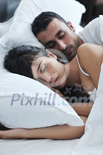 happy young healthy people couple have good time in their bedroom make love and sleep happy young healthy people couple have good time in their bedroom make love and sleep