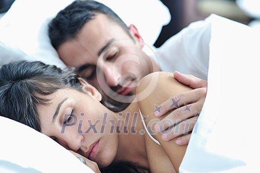 happy young healthy people couple have good time in their bedroom make love and sleep happy young healthy people couple have good time in their bedroom make love and sleep