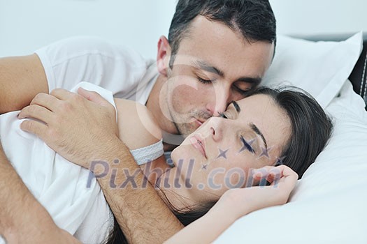 happy young healthy people couple have good time in their bedroom make love and sleep happy young healthy people couple have good time in their bedroom make love and sleep