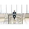 young business man lawyer with laptop alone in big bright   conference room