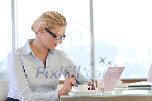 one happy young business woman working on laptop computer at group team meeting at modern office one happy young business woman working on laptop computer at group team meeting at modern office