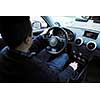 young man using new car navigation and onboard vehicle transport system