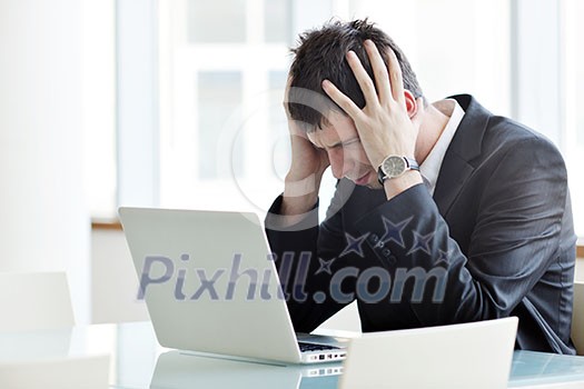 young business man lawyer with laptop alone in big bright conference room young business man lawyer with laptop alone in big bright conference room