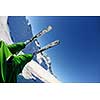 skier skiing downhill on fresh powder snow  with sun and mountains in background