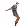young boy man teen dancing and jumping isolated on white background in studio