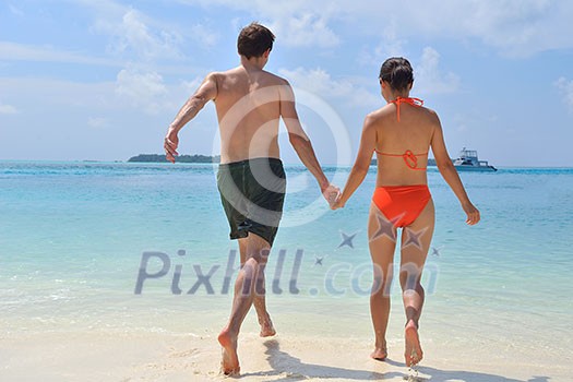 happy young romantic couple in love have fun running and relaxing on beautiful beach happy young romantic couple in love have fun running and relaxing on beautiful beach