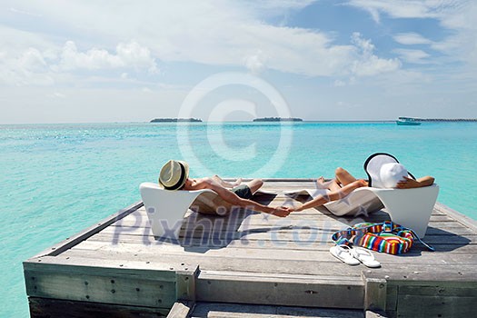 happy young romantic couple in love have fun running and relaxing on beautiful beach happy young romantic couple in love have fun running and relaxing on beautiful beach