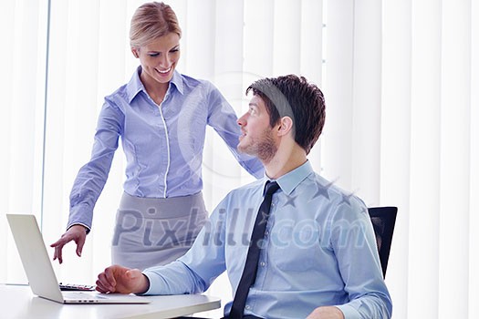 Group of happy young business people in a meeting at office Group of happy young business people in a meeting at office