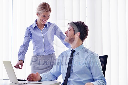 Group of happy young business people in a meeting at office Group of happy young business people in a meeting at office