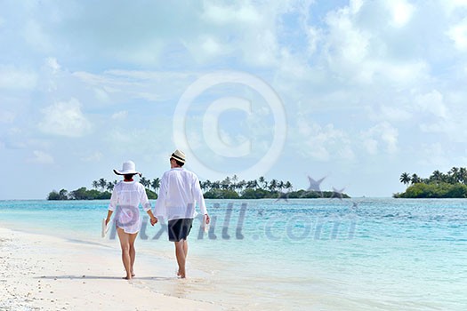 happy young romantic couple in love have fun running and relaxing on beautiful beach happy young romantic couple in love have fun running and relaxing on beautiful beach