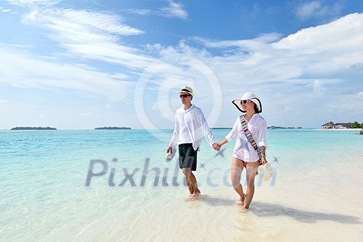 happy young romantic couple in love have fun running and relaxing on beautiful beach happy young romantic couple in love have fun running and relaxing on beautiful beach