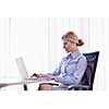 portrait of Young pretty business woman work on  notebook computer  in the bright modern office indoors