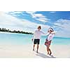 happy young romantic couple in love have fun running and relaxing on beautiful beach