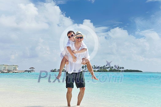 happy young romantic couple in love have fun running and relaxing on beautiful beach happy young romantic couple in love have fun running and relaxing on beautiful beach
