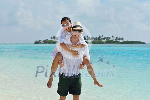 happy young romantic couple in love have fun running and relaxing on beautiful beach happy young romantic couple in love have fun running and relaxing on beautiful beach