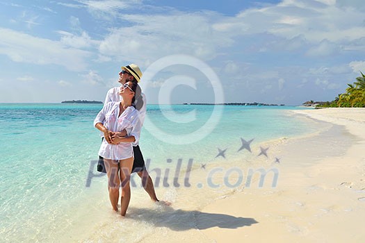 happy young romantic couple in love have fun running and relaxing on beautiful beach happy young romantic couple in love have fun running and relaxing on beautiful beach