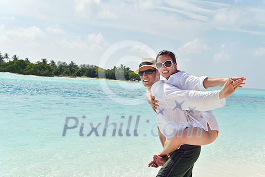 happy young romantic couple in love have fun running and relaxing on beautiful beach happy young romantic couple in love have fun running and relaxing on beautiful beach