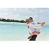 happy young romantic couple in love have fun running and relaxing on beautiful beach