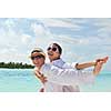happy young romantic couple in love have fun running and relaxing on beautiful beach