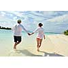 happy young romantic couple in love have fun running and relaxing on beautiful beach