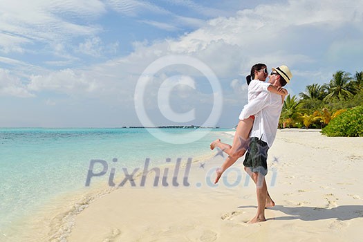 happy young romantic couple in love have fun running and relaxing on beautiful beach happy young romantic couple in love have fun running and relaxing on beautiful beach